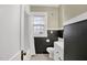 Clean bathroom with black and white tile, shower and natural light at 2401 Englewood Ave, Durham, NC 27705