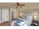 Bedroom features a ceiling fan and ample natural light, creating a warm ambiance at 2401 Englewood Ave, Durham, NC 27705