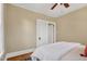 Cozy bedroom featuring hardwood floors, ceiling fan, and neutral decor at 2401 Englewood Ave, Durham, NC 27705