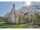 Bright and inviting yellow home boasts a brick chimney and manicured lawn at 2401 Englewood Ave, Durham, NC 27705