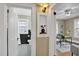 Hallway view showing access to a bathroom, office, and a built in shelf at 2401 Englewood Ave, Durham, NC 27705