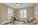 Bright office with hardwood floors, three windows, and neutral decor at 2401 Englewood Ave, Durham, NC 27705