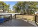 View of the wooden back deck showing the design, railings, and space to relax and enjoy the outdoors at 253 Bendemeer Ln, Rolesville, NC 27571