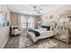Bedroom featuring a plush bed, carpeted floors, and a decorative chair at 253 Bendemeer Ln, Rolesville, NC 27571