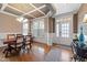 Elegant dining room featuring coffered ceilings, hardwood floors, and natural light at 253 Bendemeer Ln, Rolesville, NC 27571