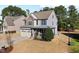 Charming two-story home with stone accents, a covered porch, and well-manicured landscaping at 253 Bendemeer Ln, Rolesville, NC 27571