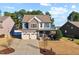 Charming two-story home featuring stone accents, a covered porch, and a two-car garage at 253 Bendemeer Ln, Rolesville, NC 27571