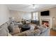 Inviting living room with fireplace, coffered accent wall, and neutral decor at 253 Bendemeer Ln, Rolesville, NC 27571