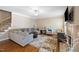 Inviting living room with fireplace, coffered accent wall, and neutral decor at 253 Bendemeer Ln, Rolesville, NC 27571