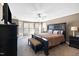 This main bedroom features a spacious layout, ceiling fan and an abundance of natural light at 253 Bendemeer Ln, Rolesville, NC 27571