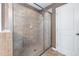 Tiled shower with glass enclosure featuring a showerhead and a built-in soap dish at 253 Bendemeer Ln, Rolesville, NC 27571