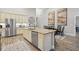Spacious kitchen with stainless steel appliances, granite countertops, and an island at 255 Thornwhistle Pl, Garner, NC 27529