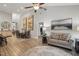 Spacious living room featuring hardwood floors, modern decor, and an open layout at 255 Thornwhistle Pl, Garner, NC 27529