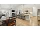 Open-concept living space connecting the dining area to the kitchen with barstool seating at 255 Thornwhistle Pl, Garner, NC 27529