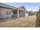Back of townhomes with screened porches, gray siding, and dry grass at 255 Thornwhistle Pl, Garner, NC 27529