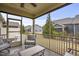 Relaxing screened porch with outdoor furniture and a view of the backyard and surrounding homes at 255 Thornwhistle Pl, Garner, NC 27529