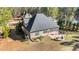 Aerial view of the house showcasing a backyard, screened porch, and fire pit at 260 Crestdale Dr, Clayton, NC 27520
