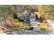 Spacious home featuring a well-manicured lawn and long driveway, surrounded by mature trees, offering a serene setting at 260 Crestdale Dr, Clayton, NC 27520
