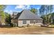 Large, well-maintained backyard with stone fire pit and screened in porch at 260 Crestdale Dr, Clayton, NC 27520