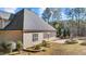 Backyard view highlighting the stone fire pit and screened in porch at 260 Crestdale Dr, Clayton, NC 27520