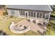 Backyard patio with a fire pit, seating area, and outdoor grill, perfect for entertaining at 260 Crestdale Dr, Clayton, NC 27520