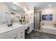 Well-appointed bathroom with double vanities, a soaking tub, and a walk-in shower at 260 Crestdale Dr, Clayton, NC 27520