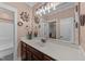 Bathroom featuring large mirror, vanity with sink, and decorative wall art at 260 Crestdale Dr, Clayton, NC 27520