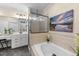 Bright primary bathroom features double vanities, a soaking tub, and a walk-in shower at 260 Crestdale Dr, Clayton, NC 27520