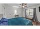 Bedroom features wood floors, bedside tables, comfortable bed, and natural light at 260 Crestdale Dr, Clayton, NC 27520