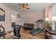 Bonus room setup as a home office with gym, futon, and adjacent bathroom at 260 Crestdale Dr, Clayton, NC 27520