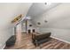 Spacious attic bonus room with modern flooring, neutral walls, and cozy seating at 260 Crestdale Dr, Clayton, NC 27520