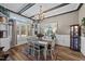 Traditional dining room with hardwood floors, wood beam ceiling, white wainscoting, and lots of natural light at 260 Crestdale Dr, Clayton, NC 27520