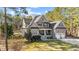 Beautiful two-story home with stone accents, a welcoming porch, and lush landscaping enhancing its curb appeal at 260 Crestdale Dr, Clayton, NC 27520
