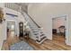 Welcoming foyer with hardwood floors, a staircase, and a view into adjacent rooms, creating an open atmosphere at 260 Crestdale Dr, Clayton, NC 27520