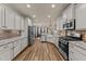 Spacious kitchen featuring stainless steel appliances, granite countertops, and ample cabinet space at 260 Crestdale Dr, Clayton, NC 27520