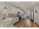 Spacious kitchen with white cabinets, stainless appliances, granite countertops, and breakfast area at 260 Crestdale Dr, Clayton, NC 27520
