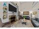 Comfortable living room with a fireplace, stylish decor, and a neutral color palette at 260 Crestdale Dr, Clayton, NC 27520