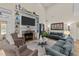 Spacious living room with built-in shelving, fireplace, hardwood floors, and comfortable seating at 260 Crestdale Dr, Clayton, NC 27520