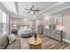 Comfortable primary bedroom features tray ceilings, hardwood floors, and neutral-colored walls at 260 Crestdale Dr, Clayton, NC 27520