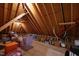 Unfinished attic featuring exposed rafters and ample space for storage with boxes and other items at 2635 Lakeview Dr, Raleigh, NC 27609