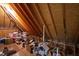 Unfinished attic space with exposed rafters offering potential for extra storage or future living space at 2635 Lakeview Dr, Raleigh, NC 27609