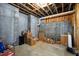 Unfinished basement with concrete walls, exposed ceiling, and ample storage space at 2635 Lakeview Dr, Raleigh, NC 27609