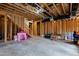 Unfinished basement with stairs, exposed ceiling, and potential for customization at 2635 Lakeview Dr, Raleigh, NC 27609
