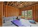 Unfinished basement area with a window, exposed ceiling, and space for activities at 2635 Lakeview Dr, Raleigh, NC 27609