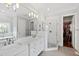 Bright primary bathroom with double vanity, luxurious shower, and walk-in closet at 2635 Lakeview Dr, Raleigh, NC 27609
