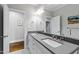 Elegant bathroom featuring double sinks, a large mirror, and modern fixtures at 2635 Lakeview Dr, Raleigh, NC 27609