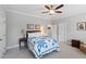 Comfortable bedroom with neutral walls, a ceiling fan, and ample closet space at 2635 Lakeview Dr, Raleigh, NC 27609