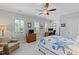 Bright bedroom with a ceiling fan, neutral walls, and natural light from the windows at 2635 Lakeview Dr, Raleigh, NC 27609