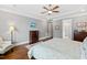 Spacious primary bedroom featuring tray ceiling, sitting area, and ensuite bathroom at 2635 Lakeview Dr, Raleigh, NC 27609