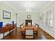 This dining room features beautiful hardwood floors, crown molding and a stunning chandelier at 2635 Lakeview Dr, Raleigh, NC 27609